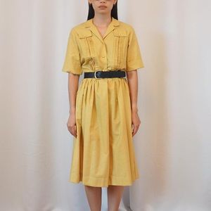 Vintage Sears yellow utility shirt dress with button front
Size 4